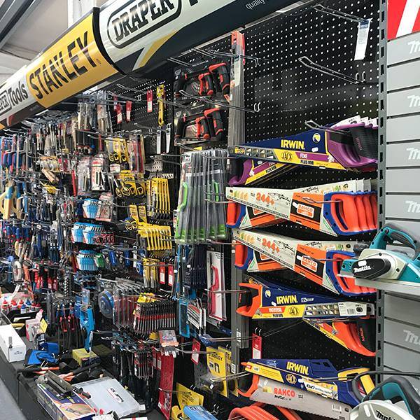 Hand tools and power tools on the shop wall
